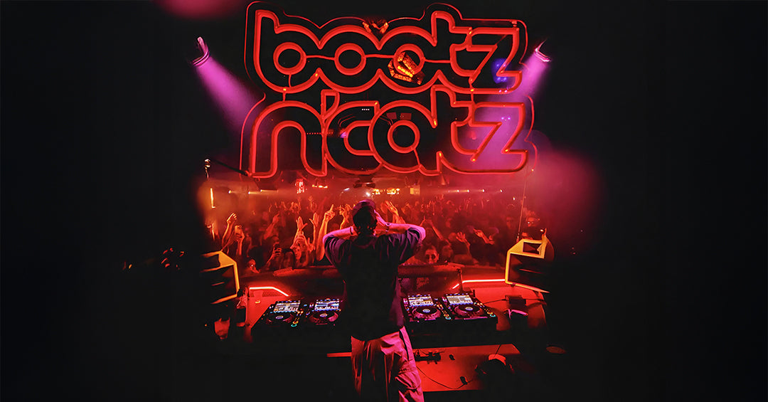 Bootz n Catz — red neon club sign